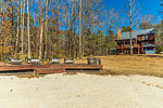 Lakeside deck and sandy beach at 101 Quail Run off Moon Branch, Dadeville, AL_Lake Martin ALWaterfront homes for sale. Professional photos and tour by Go2REasssistant.com