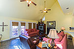 Greatroom with vaulted ceiling, fireplace opens to covered deck at 101 Quail Run off Moon Branch, Dadeville, AL_Lake Martin ALWaterfront homes for sale. Professional photos and tour by Go2REasssistant.com
