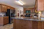 Kitchen with breakfast bar at 101 Steep Creek Road, Hope Hull, AL. Professional photos and tour by Go2REasssistant.com