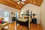 Main level Master Suite opens to covered porch at 104 Morgan Lane in Longleaf, Dadeville, AL-Lake Martin AL Waterfront homes for sale. Professional photos and tour by Go2REasssistant.com