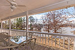 Dining on covered porch at 104 Quail Hollow Point on Sandy Creek, Dadeville, AL_Lake Martin ALWaterfront homes for sale. Professional photos and tour by Go2REasssistant.com
