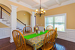Coffered ceiling and columns accent Dining Room at 105 Melison in Providence, Pike Road, AL. Professional photos and tour by Go2REasssistant.com