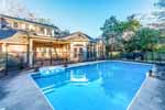 Pool with security fence at 1138 Woodley Road in historic Cloverdale, Montgomery, AL. I Shoot Houses...Professional photos and tour by Sherry Watkins at Go2REasssistant.com