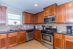 Beautiful granite accent open Kitchen at 115 Mon Louis Ct. in Bon Terre, Pike Road, AL. Professional photos and tour by Go2REasssistant.com