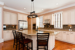 Bright open Kitchen with granite breakfast bar island at 118 Stonehouse Road in The Preserve at Stoney Ridge on Lake Martin, Dadeville, AL_Lake Martin ALWaterfront homes for sale. Professional photos and tour by Go2REasssistant.com