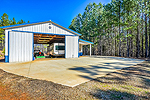 Drive-thru barn with tack room and full bath at 1227 Pine Road, New Site, AL. I Shoot Houses...Professional photos and tour by Sherry Watkins at Go2REasssistant.com