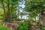 Beautifully landscaped at 122 Lighthouse Court in The Harbor on Lake Martin, Dadeville, AL.  Professional photos and tour by I Shoot Houses at Go2REasssistant.com