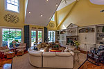 Main living area with fireplace and walkout balcony at 1270 North Ridge in The Ridge, Lake Martin waterfront homes for sale. Photos by Go2REassistant.com