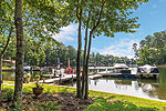 Level lot with pier, lift and boat ramp at 1270 North Ridge in The Ridge, Lake Martin waterfront homes for sale. Photos by Go2REassistant.com