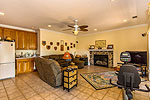 Terrace level living area with gas log fireplace and wetbar at 128 Stonehouse Road in The Preserve at Stoney Ridge, Dadeville, AL. Professional photos and tour by I Shoot Houses at Go2REasssistant.com