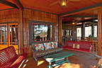 Covered porch outdoor living room at 1394 North Ridge, The Ridge, Alexander City, Lake Martin - Alexander City,  AL. Professional photos and tour by Go2REasssistant.com
