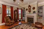 Open living room with custom cabinetry at 13 Avenue of the Waters, Lucas Point at The Waters, Pike Road, AL. Professional photos and tour by Go2REasssistant.com