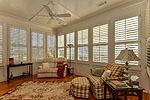 Sunroom lined with plantation shutters at 13 Avenue of the Waters, Lucas Point at The Waters, Pike Road, AL. Professional photos and tour by Go2REasssistant.com