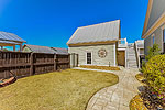 Fenced yard and detached 2-car garage with studio loft above at 13 Avenue of the Waters, Lucas Point at The Waters, Pike Road, AL. Professional photos and tour by Go2REasssistant.com