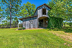 4-stall barn and tack room at 1415 Milly Branch, Pike Road, AL. I Shoot Houses...photos and tour by Sherry Watkins at Go2REasssistant.com