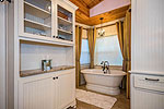 Updated bath also includes soaking tub at 151 N. Darby on Lake Martin, Eclectic, AL. Professional photos and tour by Go2REasssistant.com