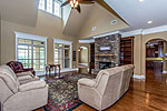 Grand Greatroom with stone fireplace at 156 Walnut Point Drive in Emerald Mountain, Wetumpka, AL. Professional photos and tour by Go2REasssistant.com