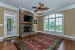 2nd stone fireplace in Gathering room off the Kitchen at 156 Walnut Point Drive in Emerald Mountain, Wetumpka, AL. Professional photos and tour by Go2REasssistant.com