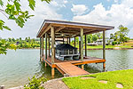 Boathouse with power lift and 2 PWC ports at 188 Rush Road, Lake Martin - Dadevile,  AL. I Shoot Houses... photos and tour by Go2REasssistant.com