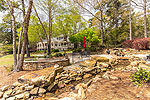 Rock patio with waterfall at 192 Whisper Wind in Windermere West, Lake Martin, Alexander City, AL. Professional photography and tour by Sherry Watkins, Go2REassistant.com