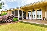 Large screen porch and covered patio at 1931 Lake Beauvoir Drive in Beauvoir, Montgomery, AL. Professional photos and tour by Go2REasssistant.com