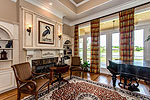 Living Room with gas log fireplace at 1931 Lake Beauvoir Drive in Beauvoir, Montgomery, AL. Professional photos and tour by Go2REasssistant.com