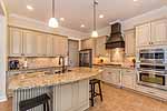 Stainless steel appliances and granite counters in kitchen at 205 Grace Chapel Trail in Providence, Pike Road, AL. Professional photos and tour by Go2REasssistant.com
