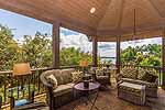 Lake views form covered porch with stone fireplace at 210 Mineridge in The Preserve at Stoney Ridge, Dadeville, AL-Lake Martin AL Waterfront homes for sale. Professional photos and tour by Go2REasssistant.com