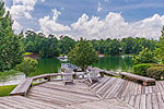 Huge deck and covered patio at 220 Catesby in Trillium, Lake Martin - Eclectic,  AL. I Shoot Houses... photos and tour by Go2REasssistant.com