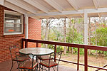 Covered deck overlooks fenced yard at 227 Forest Hills Drive, Montgomery, AL. Professional photos and tour by Go2REasssistant.com
