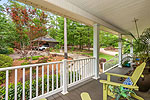 Deep covered front porch at 249 Cottage Court in The Cottages at Marina Marin Estates, Dadeville, AL_Lake Martin ALWaterfront homes for sale. I Shoot Houses...Professional photos and tour by Sherry Watkins at Go2REasssistant.com