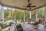 Deep covered porch overlooking the lake at 261 Cottage Court in The Cottages at Marina Marin Estates, Dadeville, AL_Lake Martin ALWaterfront homes for sale. Professional photos and tour by Go2REasssistant.com
