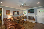 Fireplace and new hardwood floors accent main level living area at 1304 Lakewood Drive, Dadeville, AL-Lake Martin AL Waterfront homes for sale. Professional photos and tour by Go2REasssistant.com