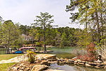 Pond on top patio with waterfall to the lake at 390 West Trillium Parkway in Trillium, Lake Martin - Alexander City,  AL. Professional photos and tour by Go2REasssistant.com