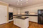 Bright kitchen with island at 419 Pine Point Circle in Trillium, Lake Martin - Jacksons Gap,  AL. Professional photos and tour by Go2REasssistant.com