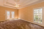 Main level Master Suite at 419 Pine Point Circle in Trillium, Lake Martin - Jacksons Gap,  AL. Professional photos and tour by Go2REasssistant.com