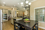 View of Kitchen and Greatroom from Breakfast Nook at 440 New Providence Way, Pike Road, AL. Professional photos and tour by I Shoot Houses at Go2REassistant.com