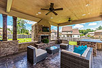 Outdoor kitchen area, bar and open patio at 440 New Providence Way, Pike Road, AL. Professional photos and tour by I Shoot Houses at Go2REassistant.com