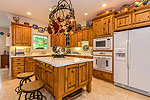 Bright Kitchen with island at 441 Windy Wood in Windermere West, Lake Martin - Alexander City,  AL. Professional photos and tour by Go2REasssistant.com