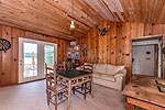 Den with a view opens to deck at 469 Hook Road on Kowliga Creek, Equality, AL_Lake Martin AL Waterfront homes for sale. Professional photos and tour by Go2REasssistant.com