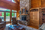 Vaulting ceiling and stone fireplace accent the Greatroom at 48 Sweet Bay in Trillium, Lake Martin - Jacksons Gap,  AL. Professional photos and tour by Go2REasssistant.com