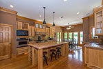 Bright, open kitchen with large island at 48 Sweet Bay in Trillium, Lake Martin - Jacksons Gap,  AL. Professional photos and tour by Go2REasssistant.com
