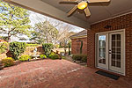 Covered patio overlooks lush landscaped yard at 516 Towne Lakes Drive in Towne Lakes, Montgomery, AL. Professional photos and tour by Go2REasssistant.com