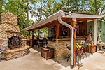 Outside kitchen and bar perfect for game day parties at 54 Raegan Point in Longleaf, Dadeville, AL_Lake Martin ALWaterfront homes for sale. Professional photos and tour by Go2REasssistant.com