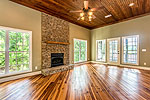 Greatroom with stone fireplace at 60 Yawl Road, Lake Martin - Dadeville,  AL. I Shoot Houses... photos and tour by Go2REasssistant.com