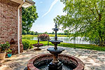 Courtyard patio with fountain at 636 Latigo Road, Waterfront Country Estate,  Ramer, AL. Professional photos and tour by Go2REasssistant.com