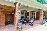 Huge covered patio with fireplace at 6601 Hollis Drive in Halcyon, Montgomery, AL. I Shoot Houses...photos and tour by Go2REasssistant.com