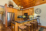 Bright, open kitchen with breakfast bar at 67 Easy Street in Eclectic, AL_Lake Martin ALWaterfront homes for sale. Professional photos and tour by Sherry Watkins with I Shoot Houses at Go2REasssistant.com