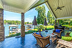 Huge covered lakeside porch at 67 Easy Street in Eclectic, AL_Lake Martin ALWaterfront homes for sale. Professional photos and tour by Sherry Watkins with I Shoot Houses at Go2REasssistant.com