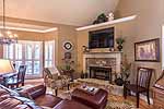 Gathering Room off Kitchen with stone fireplace at 684 Long Pine in Trillium, Lake Martin - Jacksons Gap,  AL. Professional photos and tour by Go2REasssistant.com